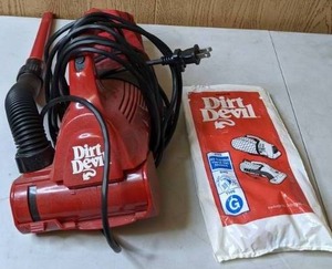 lot 513 image: Dirt Devil Handheld Corded Vacuum with Replacement Bags