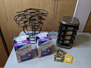 lot 425 image: Spices and Sips Lot - Ensure Nutrition Shakes, Tea, Spice Rack, Small Mug Rack, Wine Bottle Rack