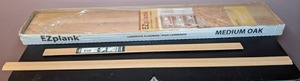 lot 38 image: Lot of Six Medium Oak EZ Planks and Two Pieces of Moulding