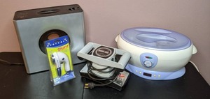 lot 37 image: Lot of 4 Personal Home Appliances (Humidifier, Massager, Paraffin Spa, Fabric Shaver)