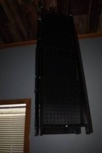 lot 9 image: Black Metal Four Shelf Unit On Casters