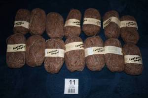 lot 11 image: Fourteen Skeins Of  Unger Fanfare Wool-Acrylic-Polyester-Rayon Blend Yarn----Brown Tones