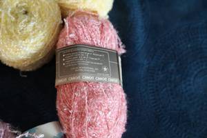 lot 18 image: Sixteen Skeins Of Yarn In Miscellaneous Colors--Pink-Yellow-Tan- Etc