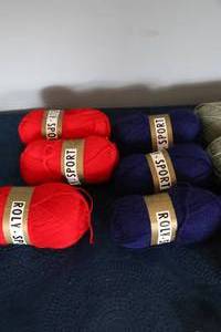 lot 30 image: Three Bright Orange--Three Royal Blue--Four Light Green--One Light Purple--Two Light Tan Skeins Of Poly Sport Yarn
