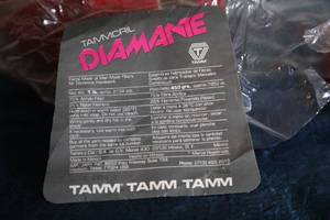 lot 45 image: Tammcrl Diamante Yarn made Of Man Made Fibers For Domestic Handwork--Three Skeins In Red