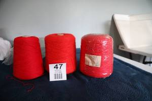 lot 47 image: Three Skeins Of Red Yarn