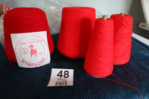 lot 48 image: Four Skeins Of Red Yarn