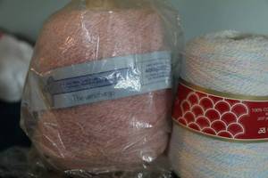 lot 50 image: Two Skeins Of Yarn--One Is 100% Courtelle White And One Is Pink