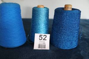 lot 52 image: Three Skeins Of Yarn In The Blues