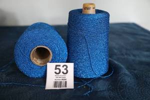 lot 53 image: Two Skeins Of Blue Yarn