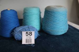 lot 58 image: Four Skeins Of Yarn In The Blues