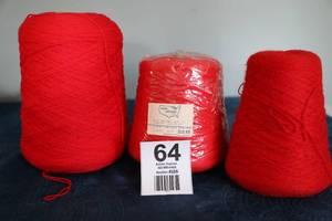 lot 64 image: Three Skeins Of Red Yarn
