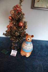 lot 111 image: Small Decorative Tree W Decorations On It---A Little Bear Figurine Is Standing Next To The Tree