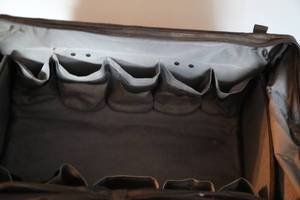 lot 114 image: Black Tough Built Container W Zippered Top & Compartments Inside & Handles To Carry It