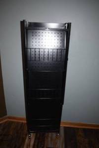 lot 8 image: Black Metal Four Shelf Unit -- Folds Up --On Casters