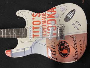 lot 48 image: Titos Handmade Vodka electric guitar, autographed by Tito