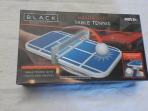 black hand held table tennis...