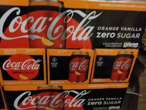 lot 285 image: 4 - 12 packs Coca Cola Orange Vanil...