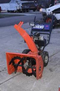 lot 1 image: Ariens 824 Snowblower