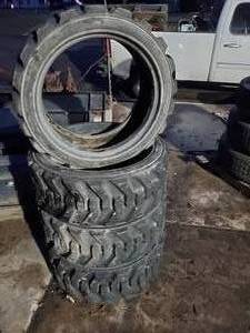 lot 19 image: NEW LSW 295-521NHS Skid Steer Tires Set of 4