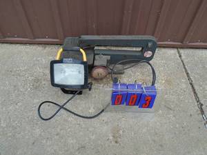 Dremel scroll saw with buffer wheel &halogen work light. As shown.