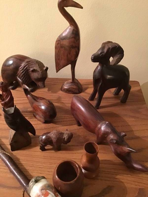 lot 635 image: Hand Carvings from Journeys Around World - Set 2 with peace pipe