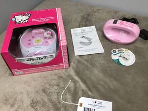 lot 625 image: Hello Kitty Stereo Clock Radio & IPod Charging Station NEVER USED