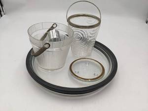 lot 18 image: Awesome Vintage Cocktail Collection- 12 Unique Bicycle Wheel Glass Tray 4 Glass Pedestal with Gold Trim 6 Vintage Mid Century Modern Ice Bucket 5 Vintage Mid Century Modern Ice Bucket and Mr. Bartender Tongues