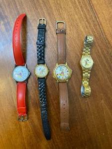 lot 57 image: 4 Mickey Mouse Watches