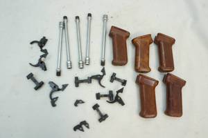 lot 60 image: Pistol grips and gun parts