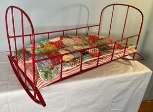 lot 27 image: Vintage Metal Doll Cradle with Mattress and Quilt
