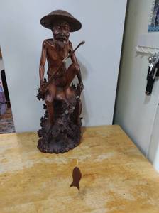 lot 16 image: Large Hand Carved Wood Fisherman Figure