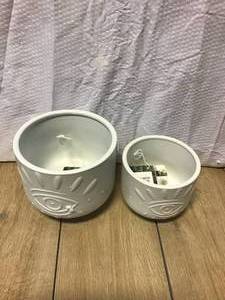 lot 64 image: Flora Bunda 6 in. and 4.75 in. Matte White Evil Eye Ceramic Plant Pot with Legs (Set of 2) Customer Returns See Pictures