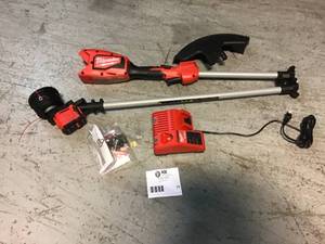lot 77 image: Milwaukee M18 18-Volt Lithium-Ion Brushless Cordless String Trimmer wih a Charger NO BATTERY INCLUDED Cusomer return see pictures