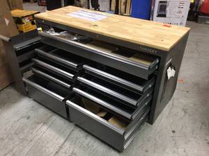 lot 108 image: Husky 61 in. W 10-Drawer, Deep Tool Chest Mobile Workbench in Metallic Silver with Sliding Vertical Bin Storage Drawer Dented on back Corner See Pictures