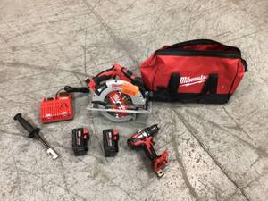 lot 106 image: M18 18-Volt Lithium-Ion Brushless Cordless Hammer Drill and Circular Saw Combo Kit (2-Tool) with Two 4.0 Ah Batteries by Milwaukee Customer Returns See Pictures