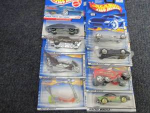 lot 115 image: 8 Assorted Hot Wheels Vehicles...