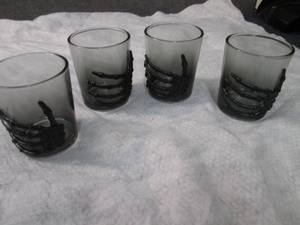 lot 414 image: 4 Skeleton Hand 3 oz Shot Glasses...
