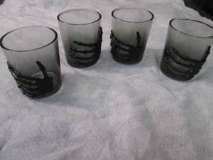 lot 415 image: 4 Skeleton Hand 3 oz Shot Glasses...