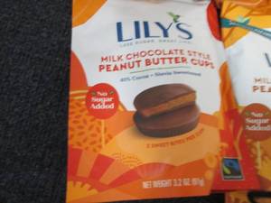 lot 126 image: 12- 3.2 oz Bags Lilys Milk Chocola...