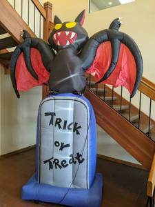 lot 244 image: Haunted Hill Farm 10 Lighted Inflatable Bat on a Tombstone Halloween Decor