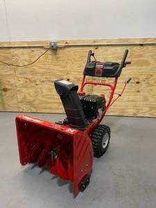lot 5 image: TROY-BILT 24 in. 208 cc Two-Stage Gas Snow Blower with Electric Start Self Propelled