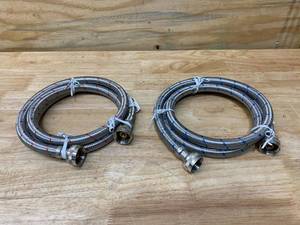 lot 83 image: EVERBILT 34 in. FIP x 34 in. FIP x 60 in. Stainless Steel Washing Machine Hose Set