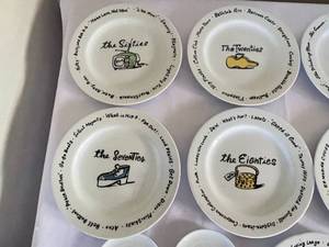 lot 74 image: Pottery Barn Fun and Decorative Decade Themed Plates