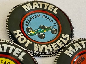 lot 158 image: Three Vintage Hot Wheels Buttons