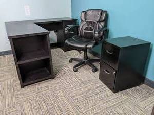 L shaped desk with office chair and...