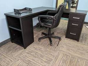 L shaped desk and office chair. Des...