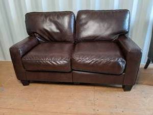 Brown faux leather couch measures 3...