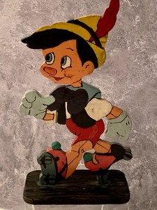 lot 28 image: Vintage 1940s Pinocchio Composition Bank and Wood Folk Art Cut Out