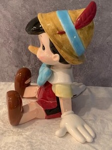 lot 17 image: Schmid Ceramic Sitting Pinocchio Figurine